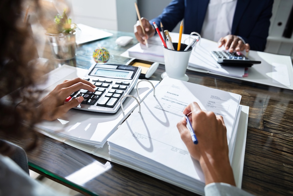 person looking at financial documents